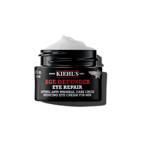 A 0.5 fl oz jar of Kiehl's Age Defender Eye Repair, a premium anti-aging treatment specifically formulated for men's skin.